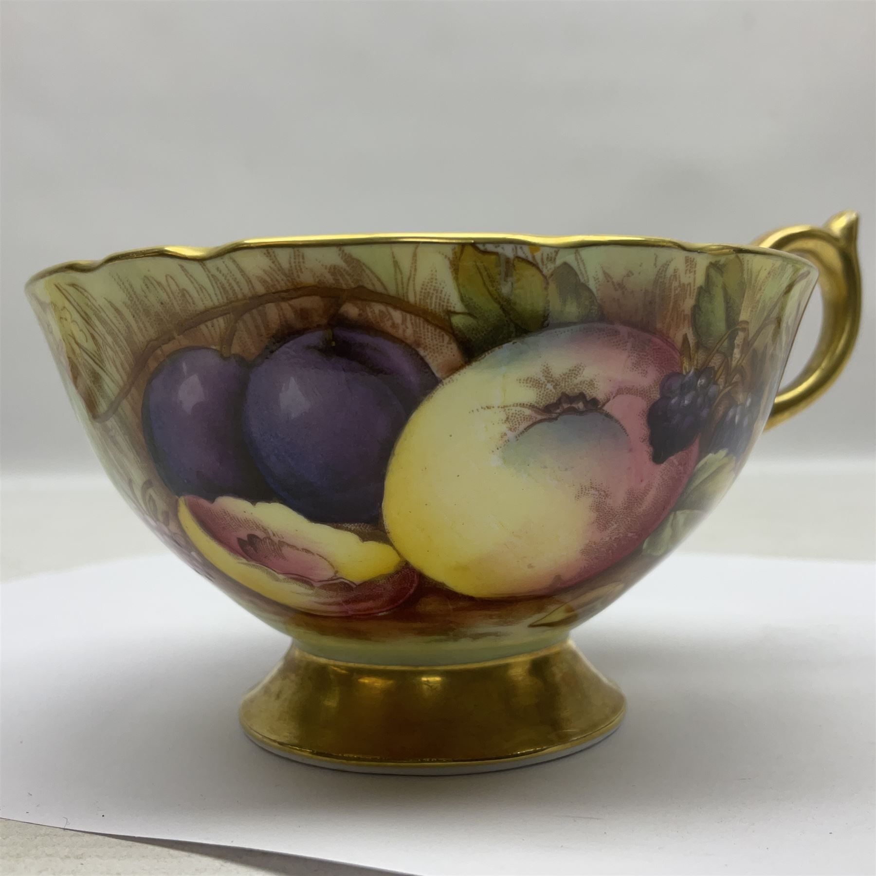 Pair Aynsley Orchard Gold pattern teacups and saucers with gilt interior 