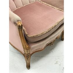 *20th century beech framed French style two seat settee, the shaped and moulded frame carved with foliate cartouche and flower heads, cabriole supports, W140cm, H99cm