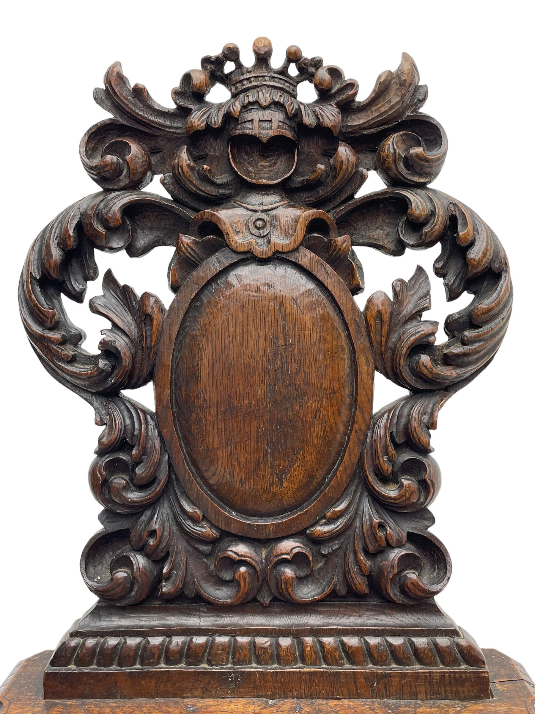 19th century oak hall chair, shaped and pierced back carved with crown cresting over curled and scrolled acanthus leaves, tapered rectangular seat with foliate carved corners and fluted chamfered edge, on turned and lobe carved splayed supports 