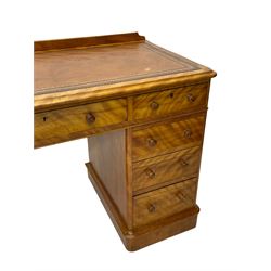 Victorian satin walnut twin pedestal desk, moulded rectangular top with rounded corners and raised back, inset leather writing surface with tooled borders, fitted with nine drawers with turned handles, on moulded plinth base 