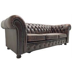 Chesterfield three-seat sofa bed upholstered in buttoned brown leather