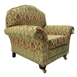 Traditional design two seat sofa, high back with scrolled arms, upholstered in beige fabric with red and green damask motifs, on castor supports (L178cm, D100cm, H89cm); matching armchair (L109cm, D89cm, H89cm)