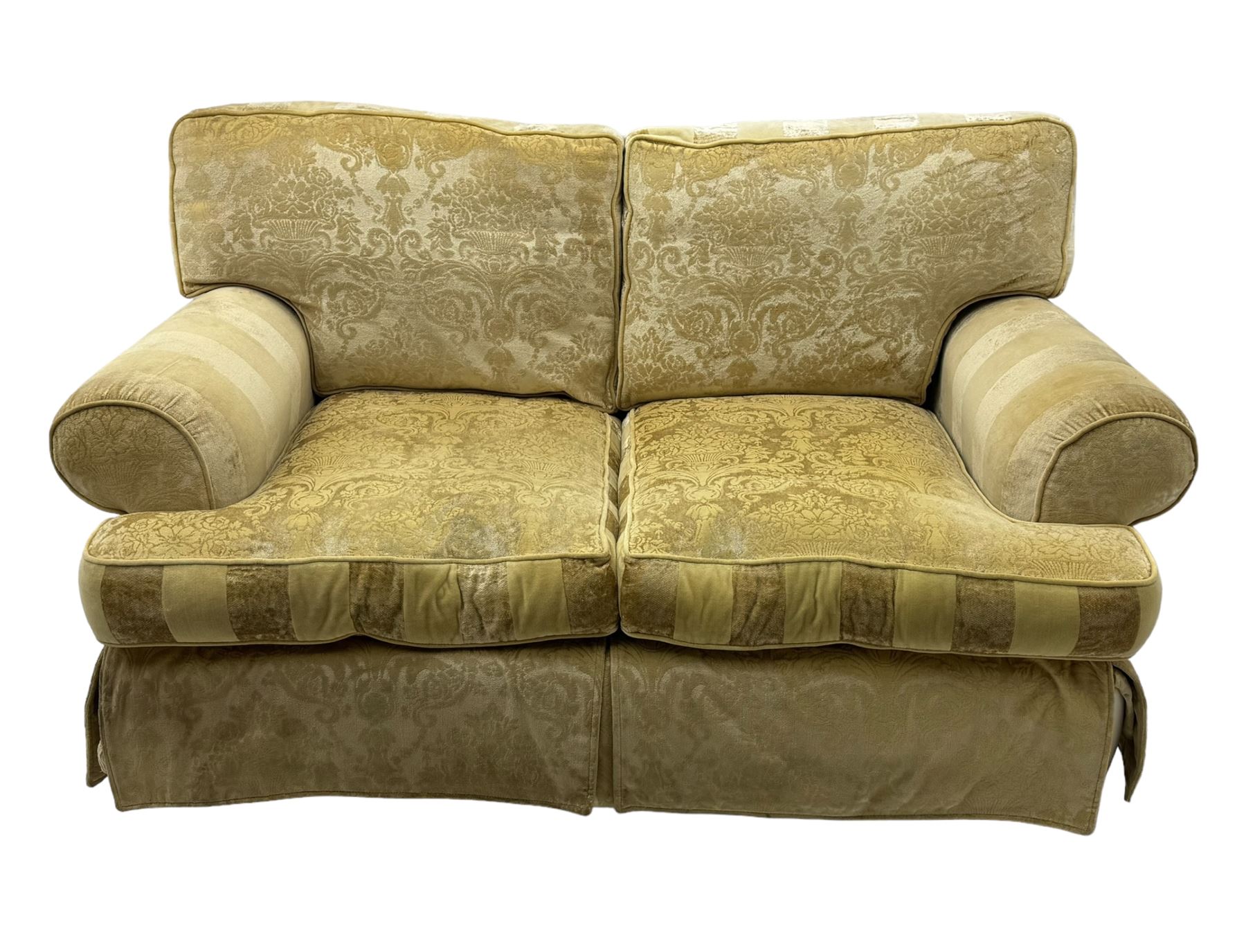 Contemporary two-seat sofa, upholstered in damask fabric with a pale gold floral pattern, rolled arms, loose back and seat cushions, on matching skirted base with concealed castors