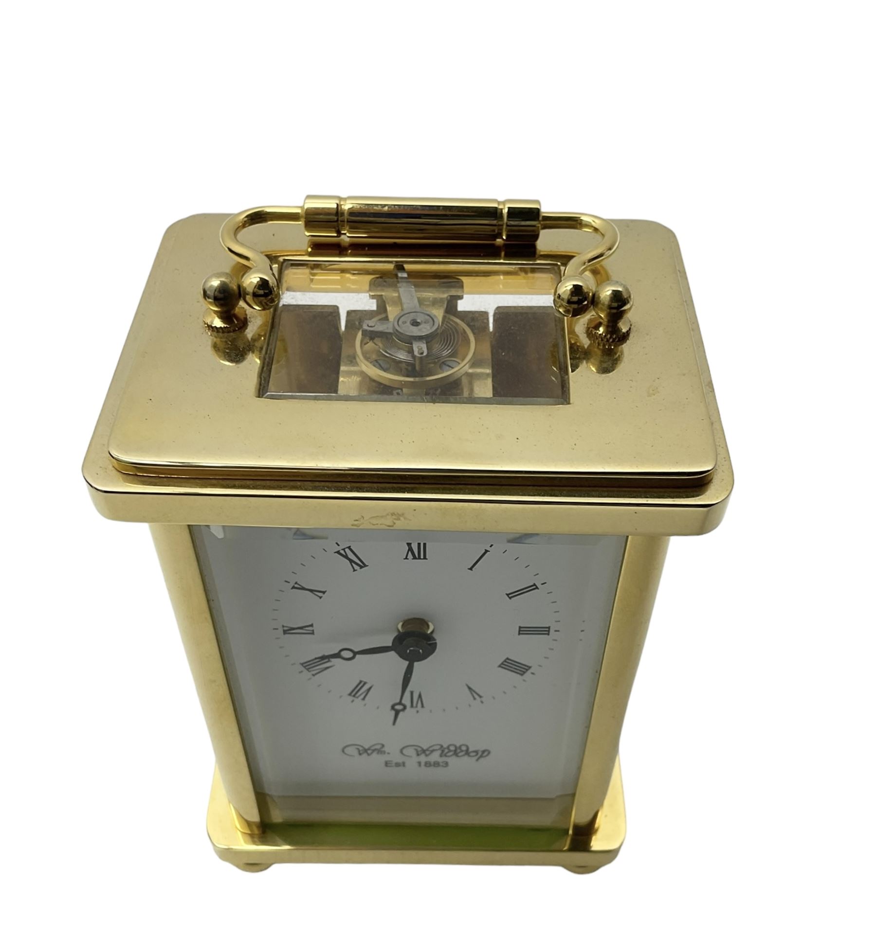 William Widdop - 20th century 8-day  brass cased carriage clock with an enamel dial, Roman numerals, minute track and steel moon hands, single train timepiece movement with a lever platform escapement, housed in a bespoke leather case, with key. 