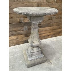 Cast stone garden bird bath, circular dished top, raised on square tapering column, on stepped base with separate mounting plinth