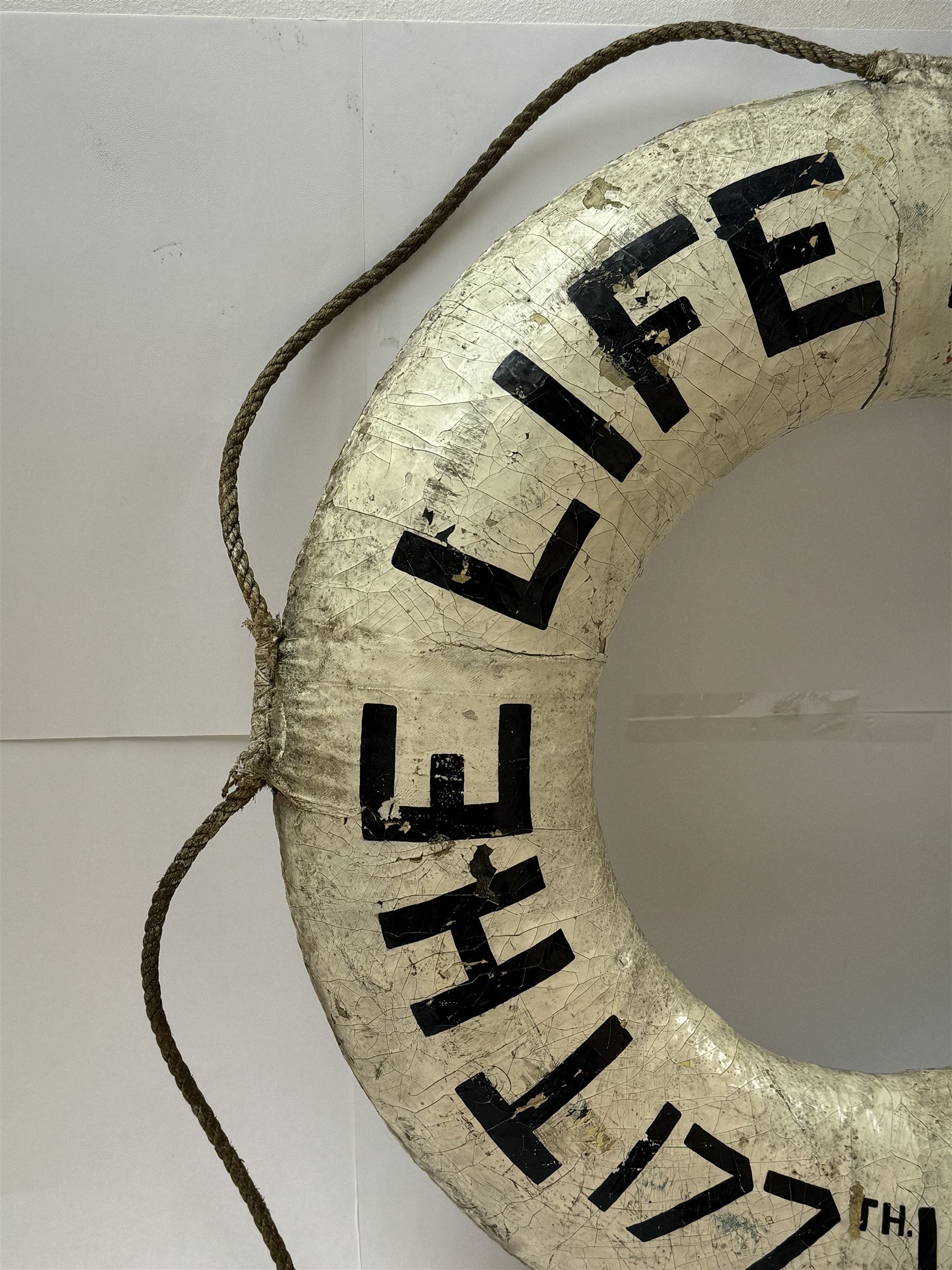 Early 20th century lifebuoy, painted in black lettering 'The Life Boys 177th London Team' upon a white ground, D53cm