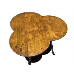 Late 19th to early 20th century stained beech 'Gypsy' table, trefoil or clover shaped top on turned supports united by undertier, on cast metal and glass ball feet 