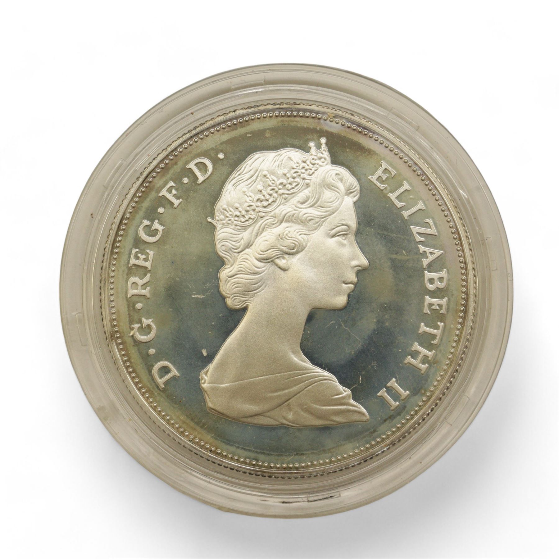 Eight The Royal Mint United Kingdom silver proof coins, comprising 1980 '80th Birthday' crown, 1981 'His Royal Highness The Prince Of Wales And Lady Diana Spencer' crown, 1984, 1985, 1986 and 1987 one pounds, all cased with certificates and a 1977 crown cased no certificate (8)