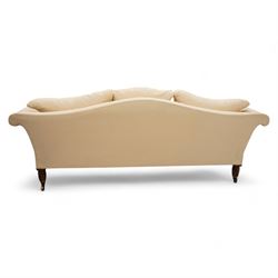 Grande three-seat camelback sofa, upholstered in calico base layer, on turned feet painted to resemble rosewood, fitted with brass cups and castors