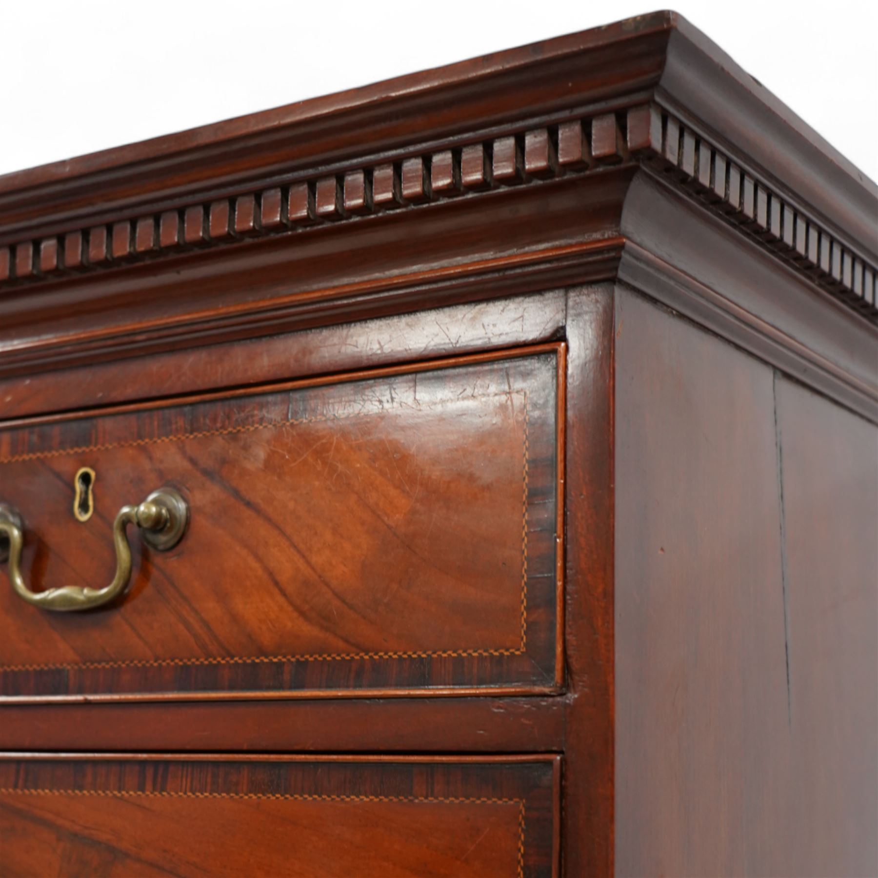 George III mahogany chest-on-chest, projecting moulded and dentil cornice, fitted with two short over six long graduating cock-beaded drawers, each with mahogany band and checkered stringing, brass swan neck handles and circular plates, on ogee bracket feet