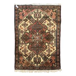 Persian design ivory ground rug, pale rose floral medallion with surrounding foliate decoration