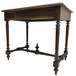 19th century walnut side table,  rectangular top with lunette carved moulded edge, the frieze drawer carved with ribbon and extending vine branch and grapes, on turned and fluted supports united by fluted stretcher with centre finial 