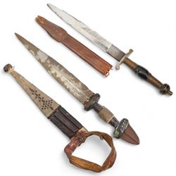 North African arm dagger with leather scabbard, blade length 19cm and a South American hunting knife, the ricasso marked 'Rio Branco', blade length 18cm (2) 