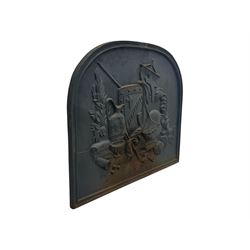 French cast iron fireback, arched form with relief of medieval armour and heraldic symbols, including a shield with a cross and a plumed helmet