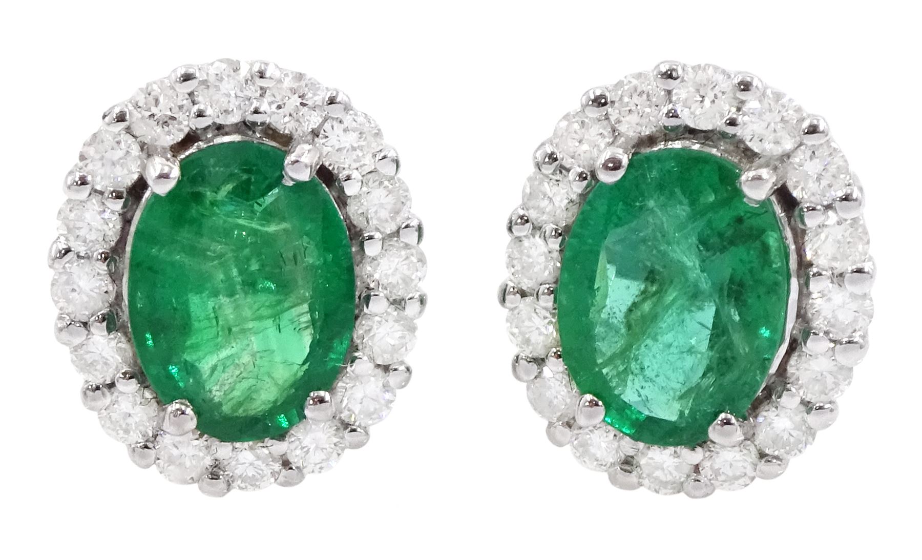 Pair of 18ct white gold oval cut emerald and round brilliant cut diamond stud earrings, stamped, total emerald weight approx 1.95 carat, total diamond weight approx 0.60 carat