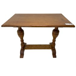 20th century oak occasional table, rectangular top on turned twin pillar supports, carved with squirrel motif, on shaped sledge feet united by stretcher 