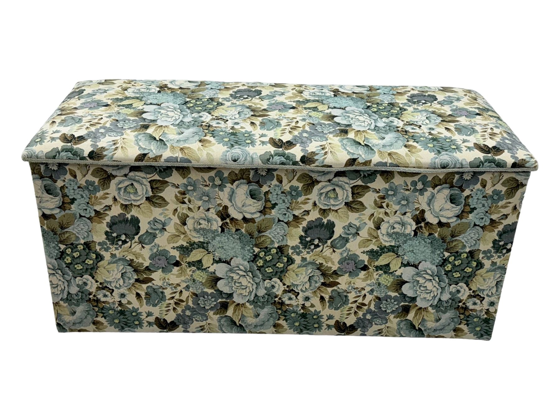 Mid 20th century oak blanket box, upholstered in floral pattern fabric, padded hinged lid enclosing oak interior with two removable trays, brass side handles, on round metal supports