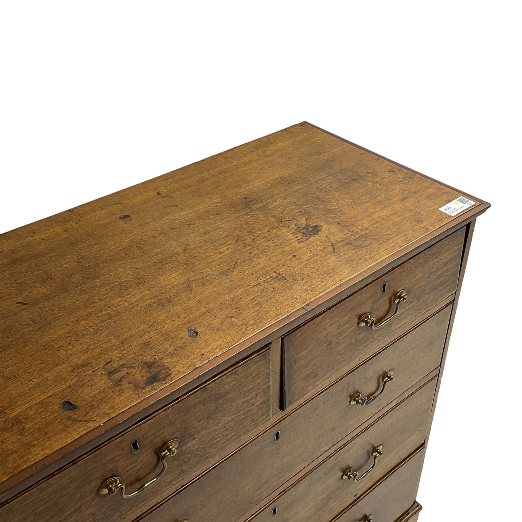 George III oak straight-front chest, fitted with two short over three long graduating drawers, lower moulded edge over shaped bracket feet