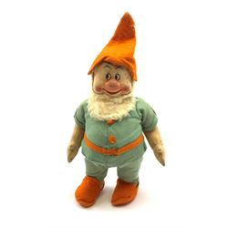 Chad Valley pressed felt figure of the Disney Snow White dwarf 'Doc' with painted facial features, standing wearing a green linen suit with orange hat, belt, buttons and shoes H13