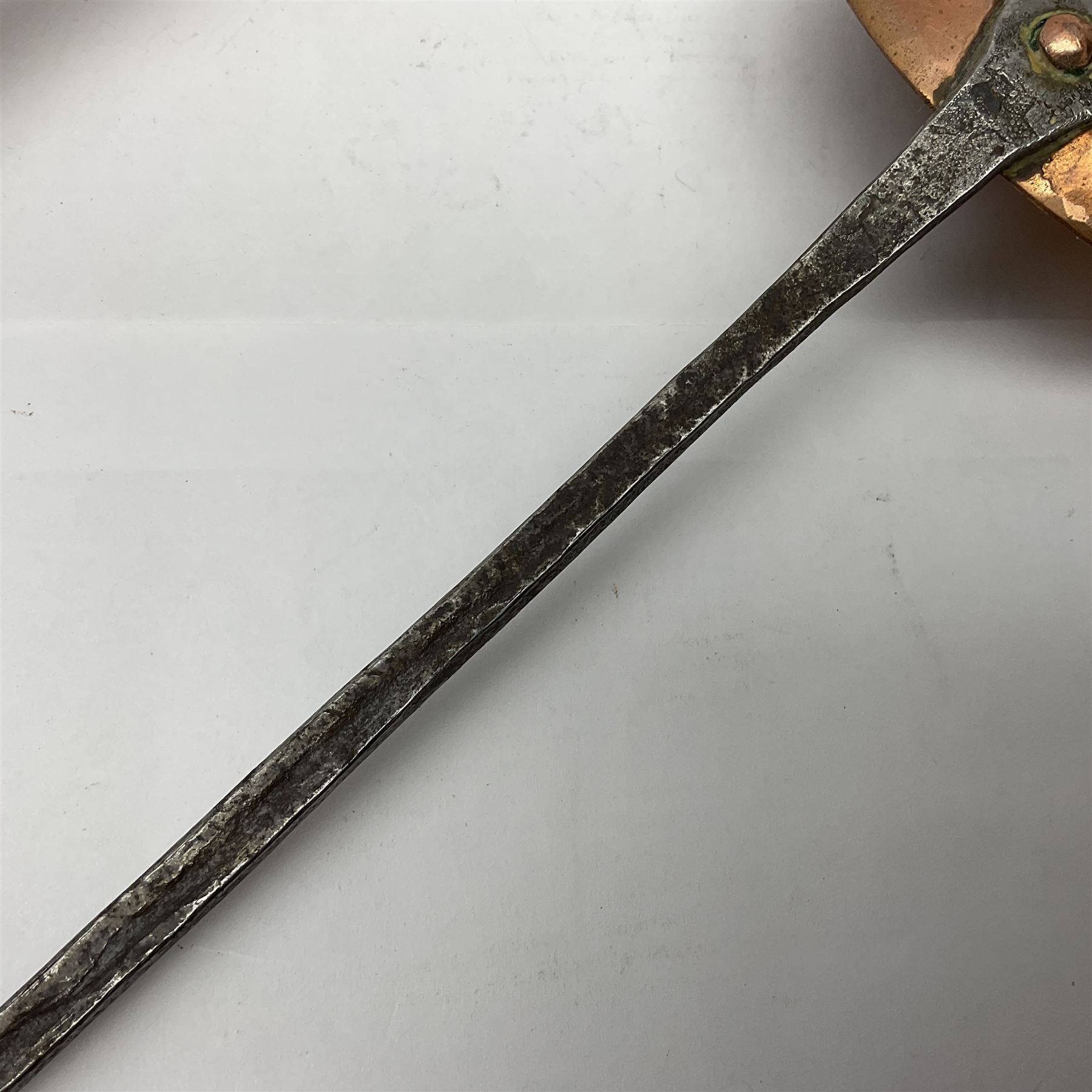 Large 19th century copper slotted spoon, with pierced flat bowl, L55cm, together with two 19th century iron handled ladles with circular copper bowls, largest example L48.5cm, (3)