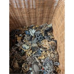 Collection of costume brooches, including ceramic, novelty and animal examples, contained within an wicker basket box