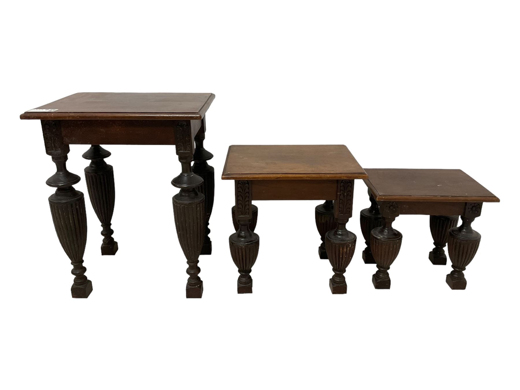 Late Victorian walnut nest of three tables, rectangular top with moulded edge, raised on reeded and turned urn shaped supports with acanthus leaf carving and square feet