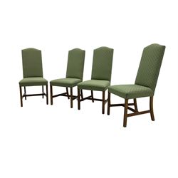 Early 20th century oak extending dining table, rectangular top with rounded corners, on turned baluster supports united by X-stretchers, fitted with a pull-out extending mechanism (106 x 142 - 228cm, H76cm); set of eight high-back dining chairs upholstered in green fabric with geometric diamond pattern