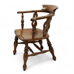 19th century elm and beech smokers bow Captains armchair, shaped and pierced splat, saddle seat, double H stretcher