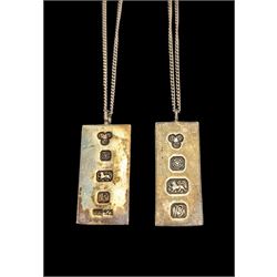 Two silver ingot pendants