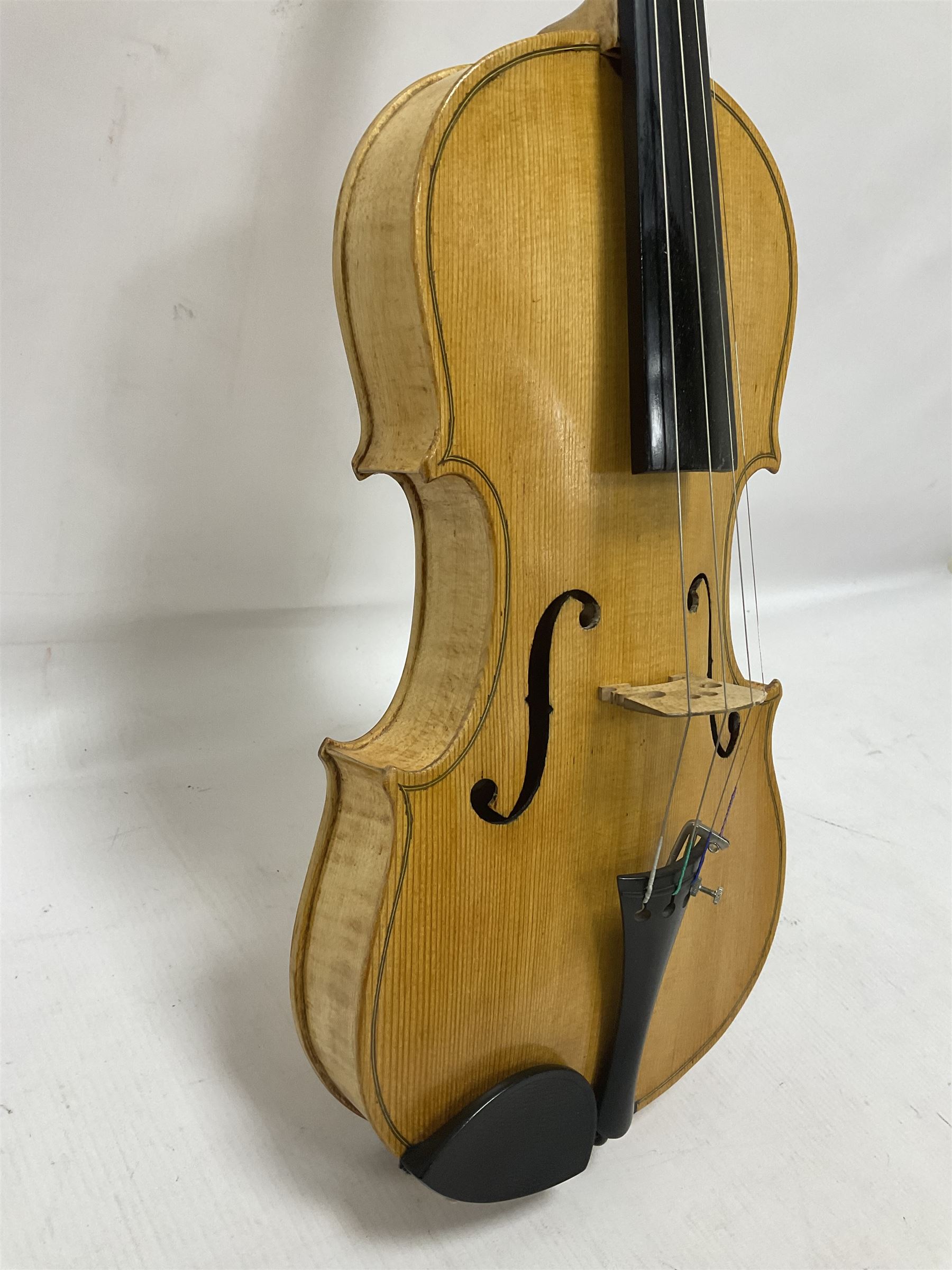 Copy of a full size Stradivarius violin with an ebonised fingerboard and tailpiece, hardwood tuning pegs and chin rest length 60cm