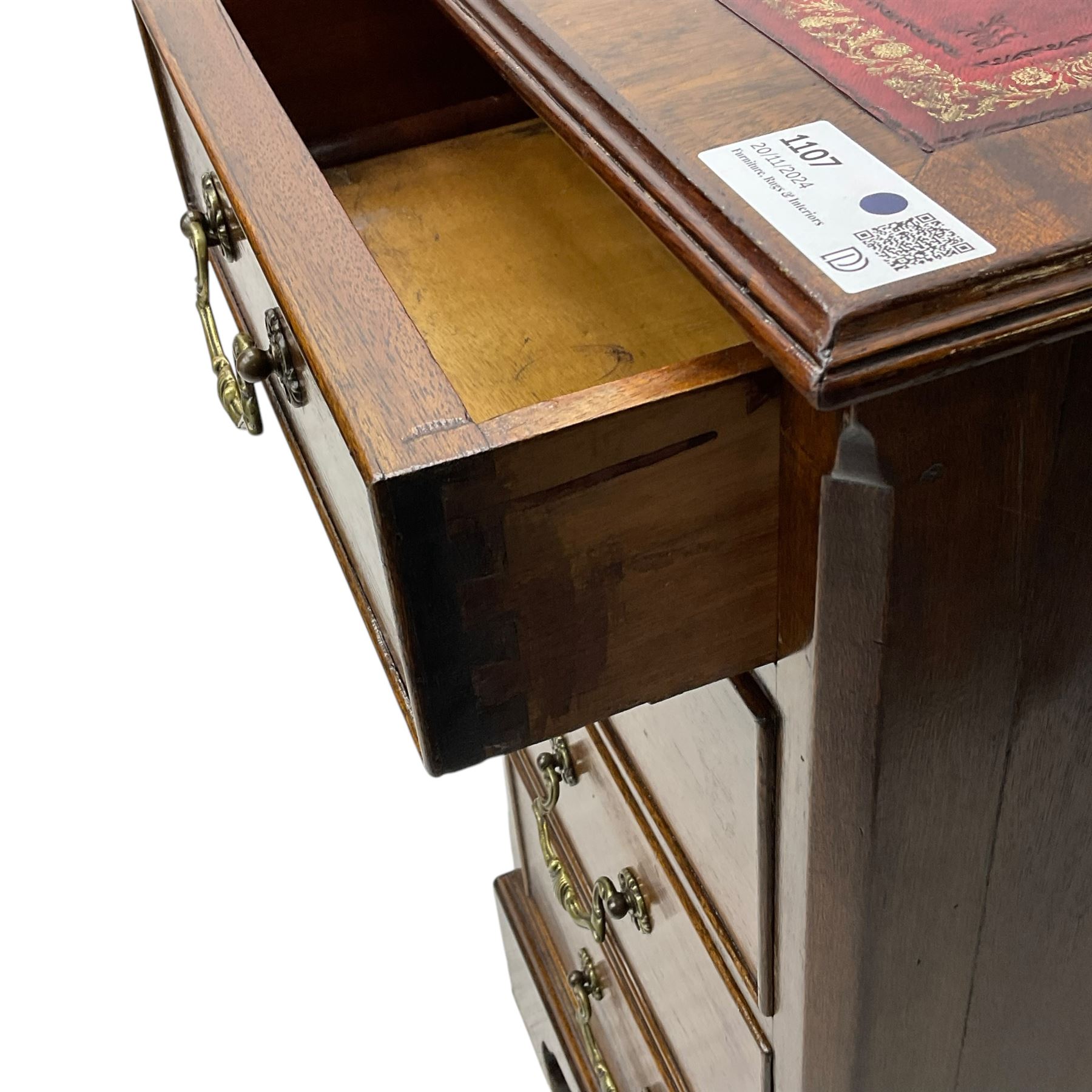 Georgian design mahogany twin pedestal desk, moulded rectangular top with red leather inset, fitted with seven drawers, on bracket feet 