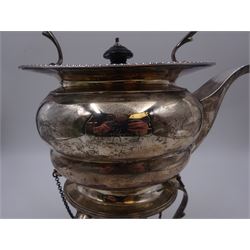 Early 20th century silver spirit kettle and burner, of oval form, with oblique gadrooned rim, engraved crest and ebonised handle and finial, the stand upon three scrolling pad feet, hallmarked Goldsmiths Silversmiths Company, London 1913, total H31cm