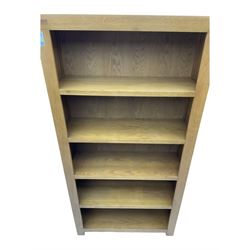 Light oak open bookcase fitted with four shelves 