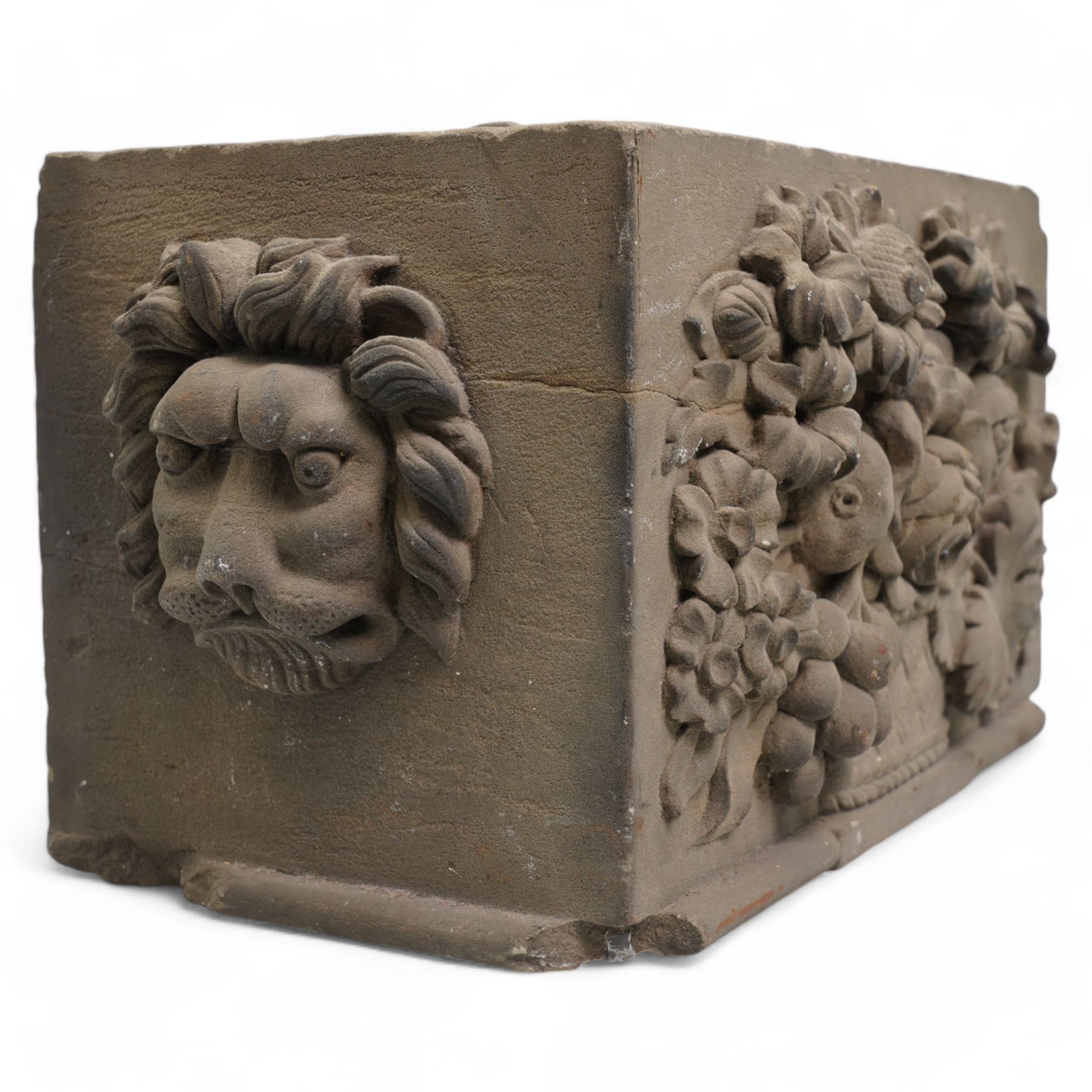 19th century rectangular coade stone casket , the front panel with a spray of flowers, the sides with lion masks 30cm x 15cm x 17cm