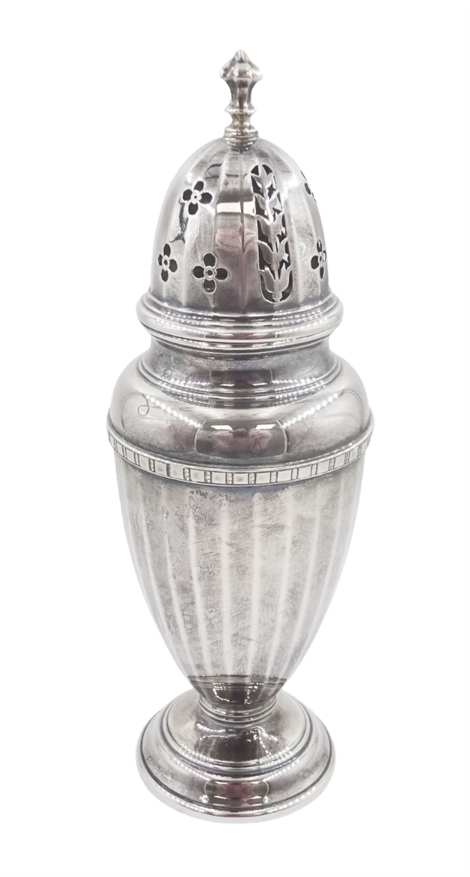 1920s silver sugar caster, of typical form with faceted body and pierced floral cover, upon stepped circular foot, hallmarked Adie Bros, Birmingham 1928, H20cm