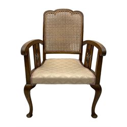 Early 20th century beech framed chair, with scalloped caned backrest, curved arms with pierced splats, upholstered seat in light pink fabric with gold trim, on cabriole supports