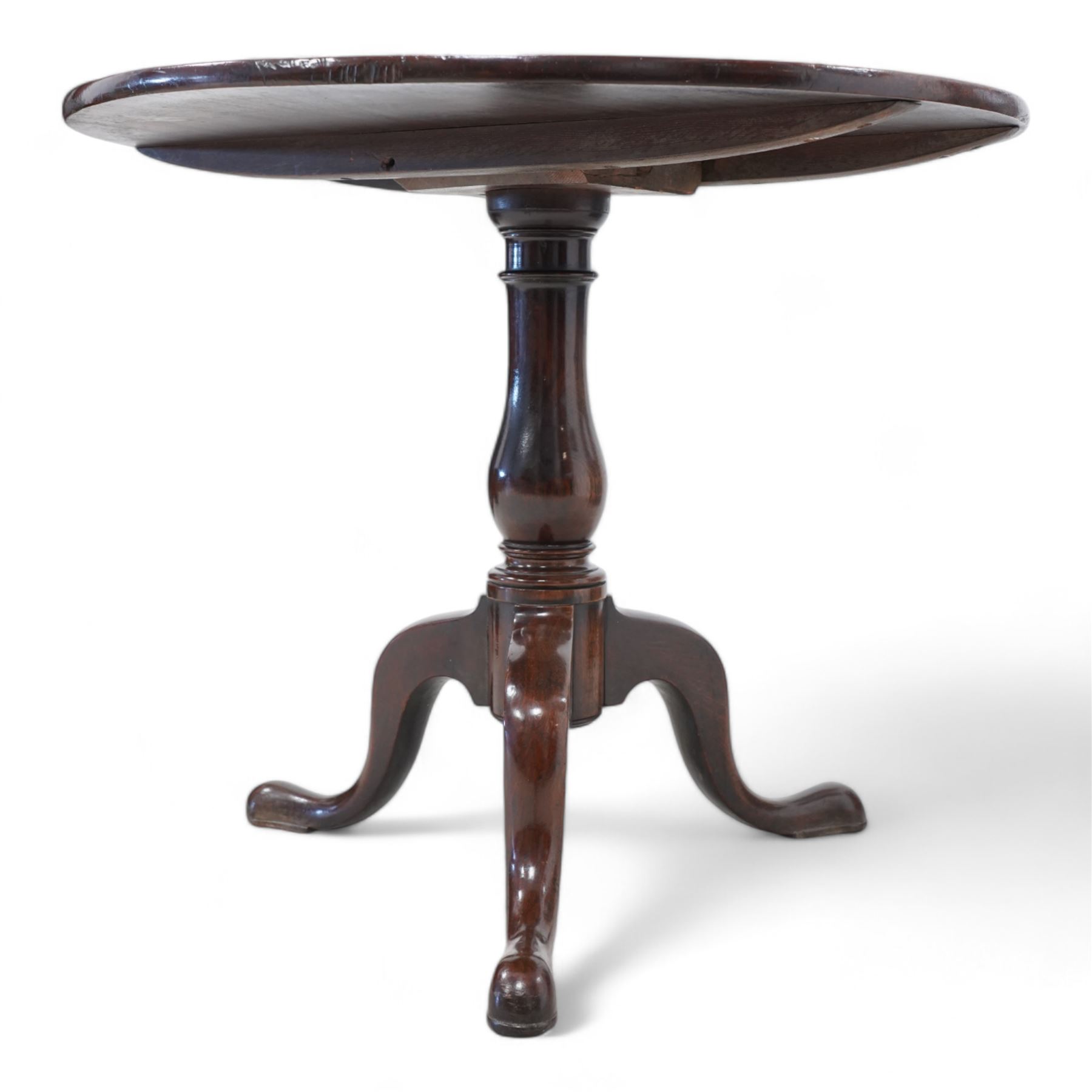 Large George III mahogany tripod table, circular single-piece tilt-top on turned baluster pedestal, three out splayed supports 