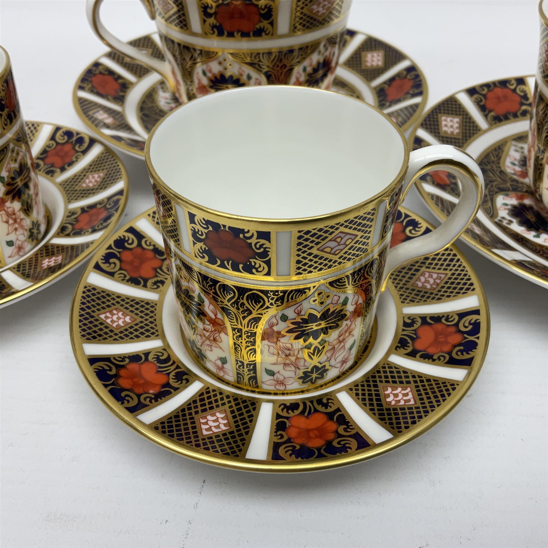 Royal Crown Derby 1128 Imari pattern two coffee cans and saucers, two teacups and saucers, all with printed mark beneath 