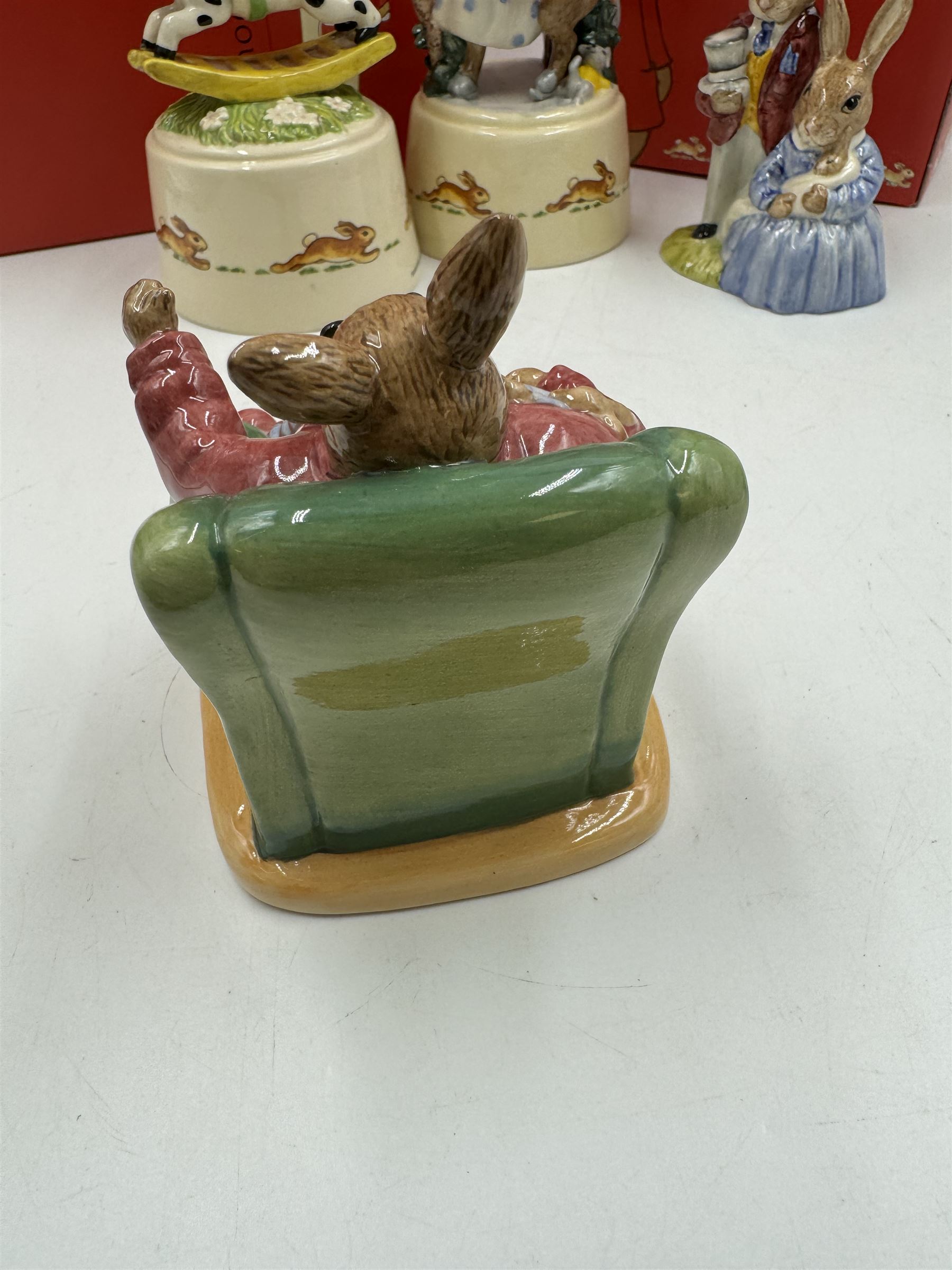 Two Royal Doulton Bunnykins music boxes, comprising Rocking Horse and Winter Waltz together with two Royal Doulton Bunnykins figures Once Upon a Time and Father, Mother & Victoria, all with original boxes  