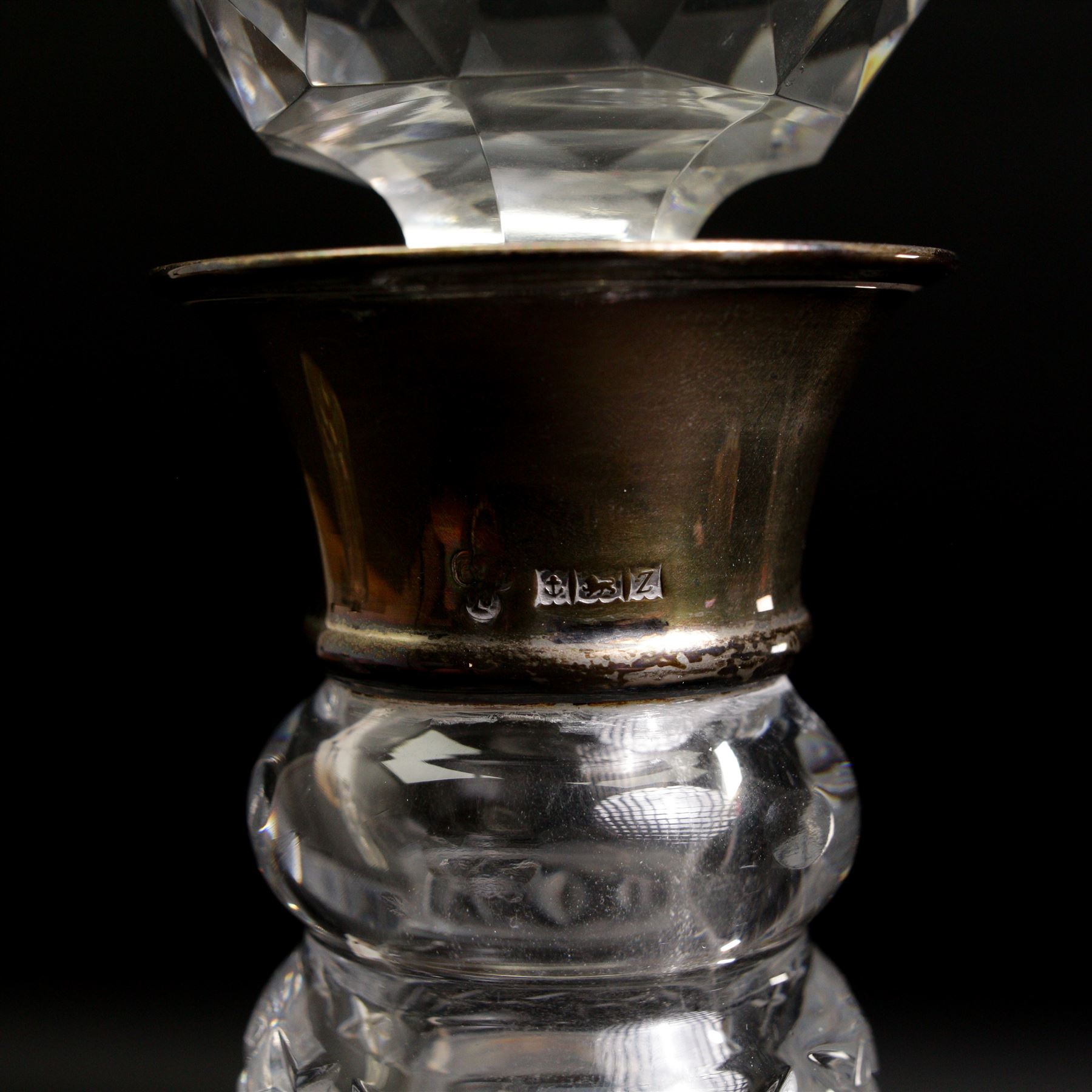 Square glass spirit decanter with silver collar and square stopper and two other decanters with silver collars (3)