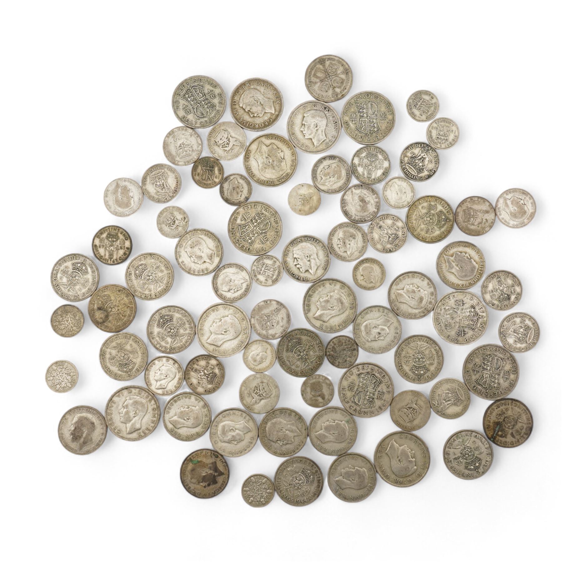 Approximately 610 grams of Great British pre 1947 silver coins, including sixpences, shillings, two shillings or florins, halfcrowns etc