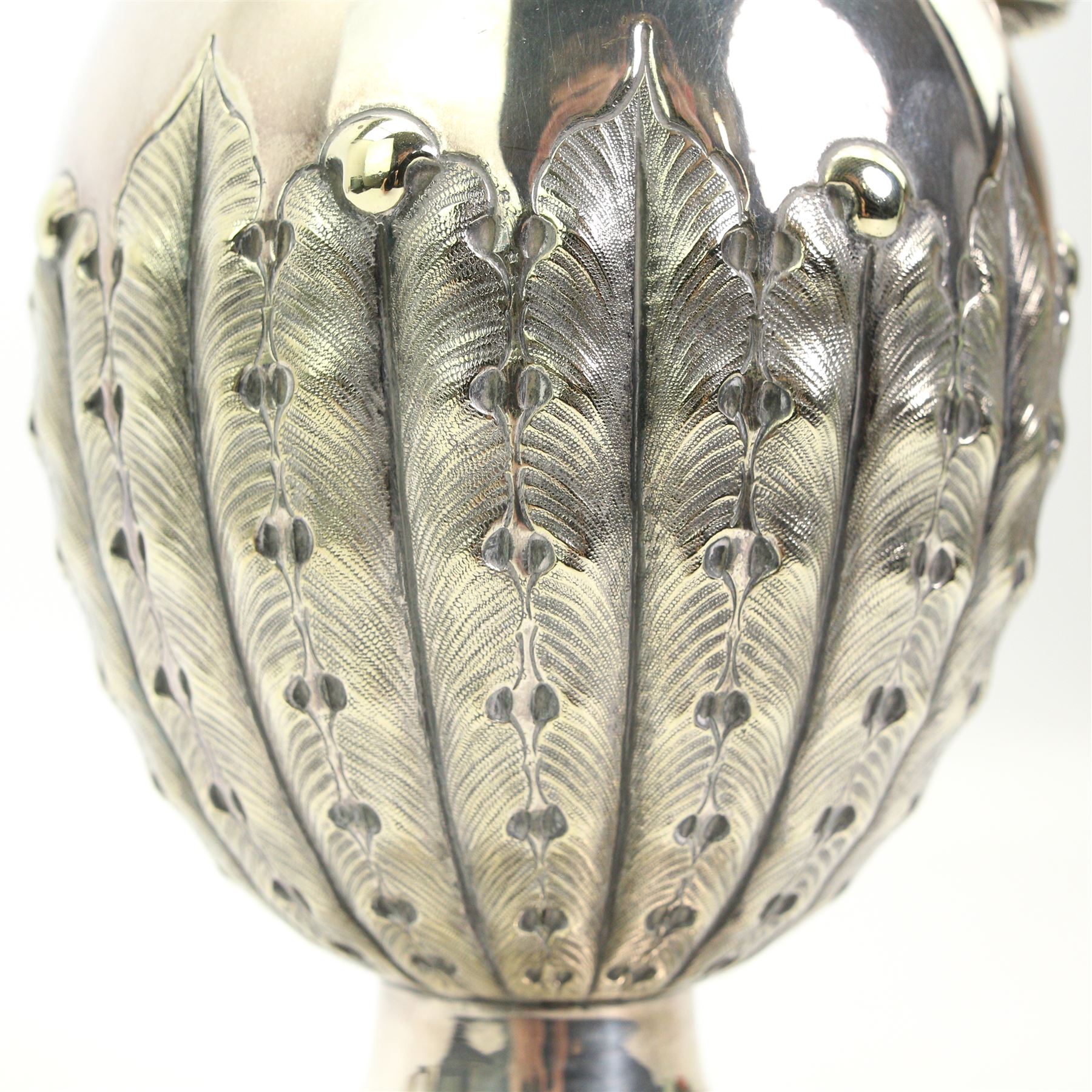 Victorian silver plated claret jug, the body of baluster form, with scroll handle, textured neck and the base cast with stiff leaves, on a beaded circular pedestal foot, H34.5cm 