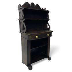 Victorian scumbled pine chiffonier, raised shaped back fitted with two shelves on S-scroll supports, rectangular top with rounded corners over single frieze drawer and open shelf, on projecting rounded sledge platforms and compressed bun feet, scumbled to resemble rosewood 