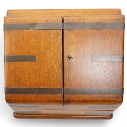 Edwardian oak correspondence box, the hinged sloping front enclosing a fitted interior incorporating a stationery rack, perpetual calendar, pen tray and two glass inkwells, H32cm x W40cm