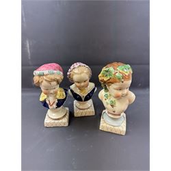 Pair or 20th century continental Bourbon children busts, together with another similar, H23cm