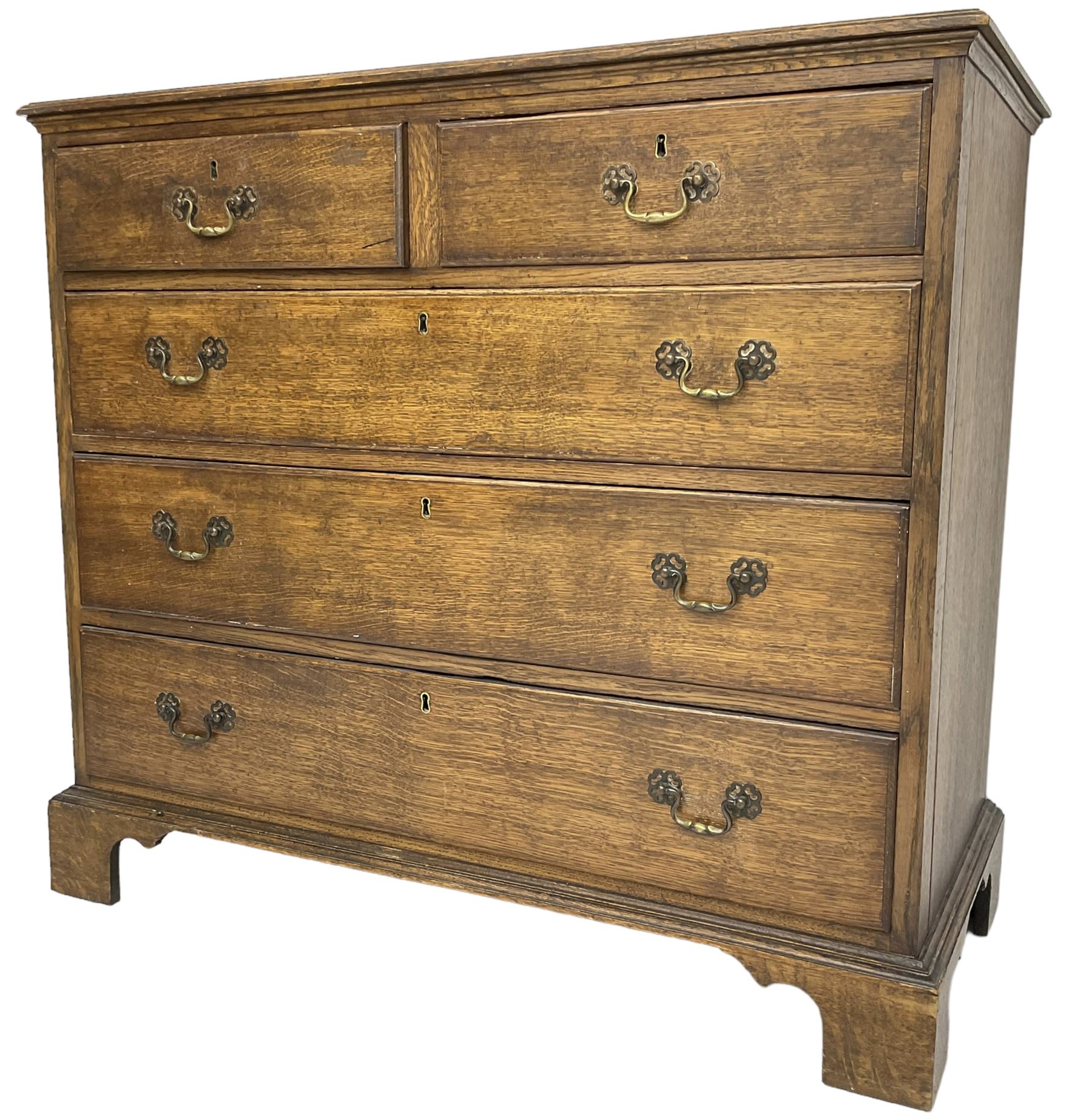 Early 20th century Georgian design oak chest, fitted with two short over three long drawers, lower moulded edge over bracket feet