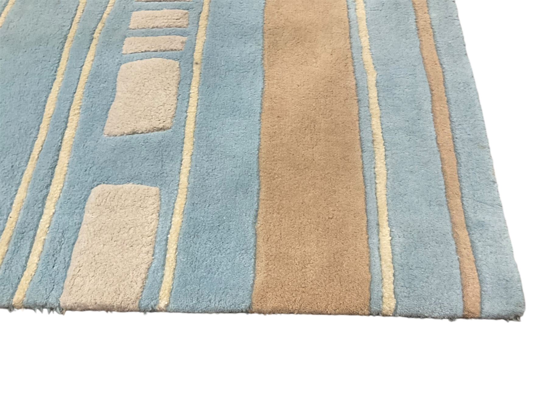 Contemporary pale indigo and beige ground rug, decorated with alternating stripes and geometric shapes