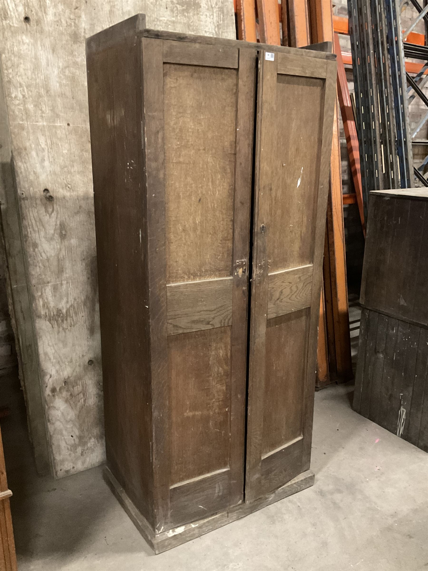 Early 20th century oak cupboard, enclosed by two panelled doors, the interior fitted with shelves and single drawer, on skirted base - THIS LOT IS TO BE COLLECTED BY APPOINTMENT FROM THE OLD BUFFER DEPOT, MELBOURNE PLACE, SOWERBY, THIRSK, YO7 1QY