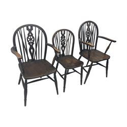 Set of six 19th century elm and ash dining chairs, hoop back with pierced wheel-shaped central splat, shaped saddle seat, raised on turned supports united by H-stretchers