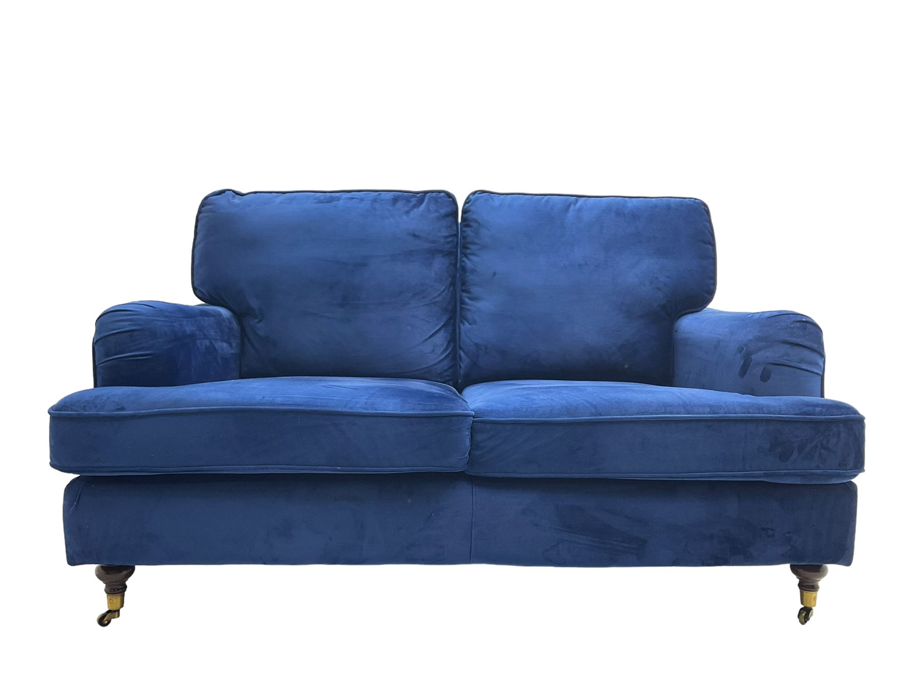 Howard design - two-seat sofa upholstered in blue fabric, traditional shape with rolled arms, on walnut finish turned feet with brushed metal cups and castors